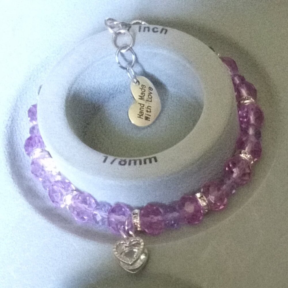 Homemade beaded bracelets with charms  Size: 7 stretch Color:Purple